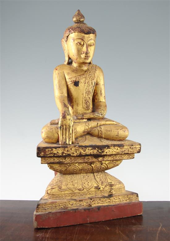 A Burmese gilt decorated seated figure of Buddha, 19th century, 50cm